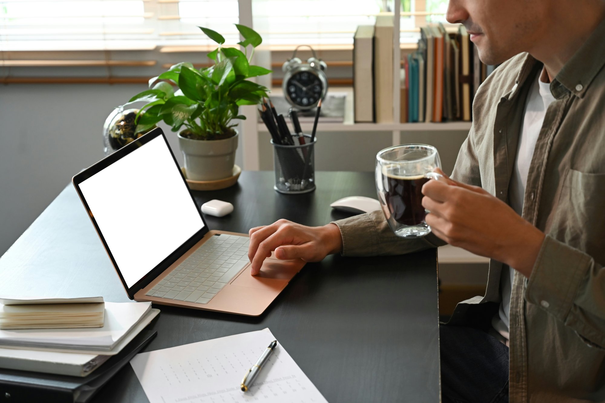 man-drinking-coffee-at-computer