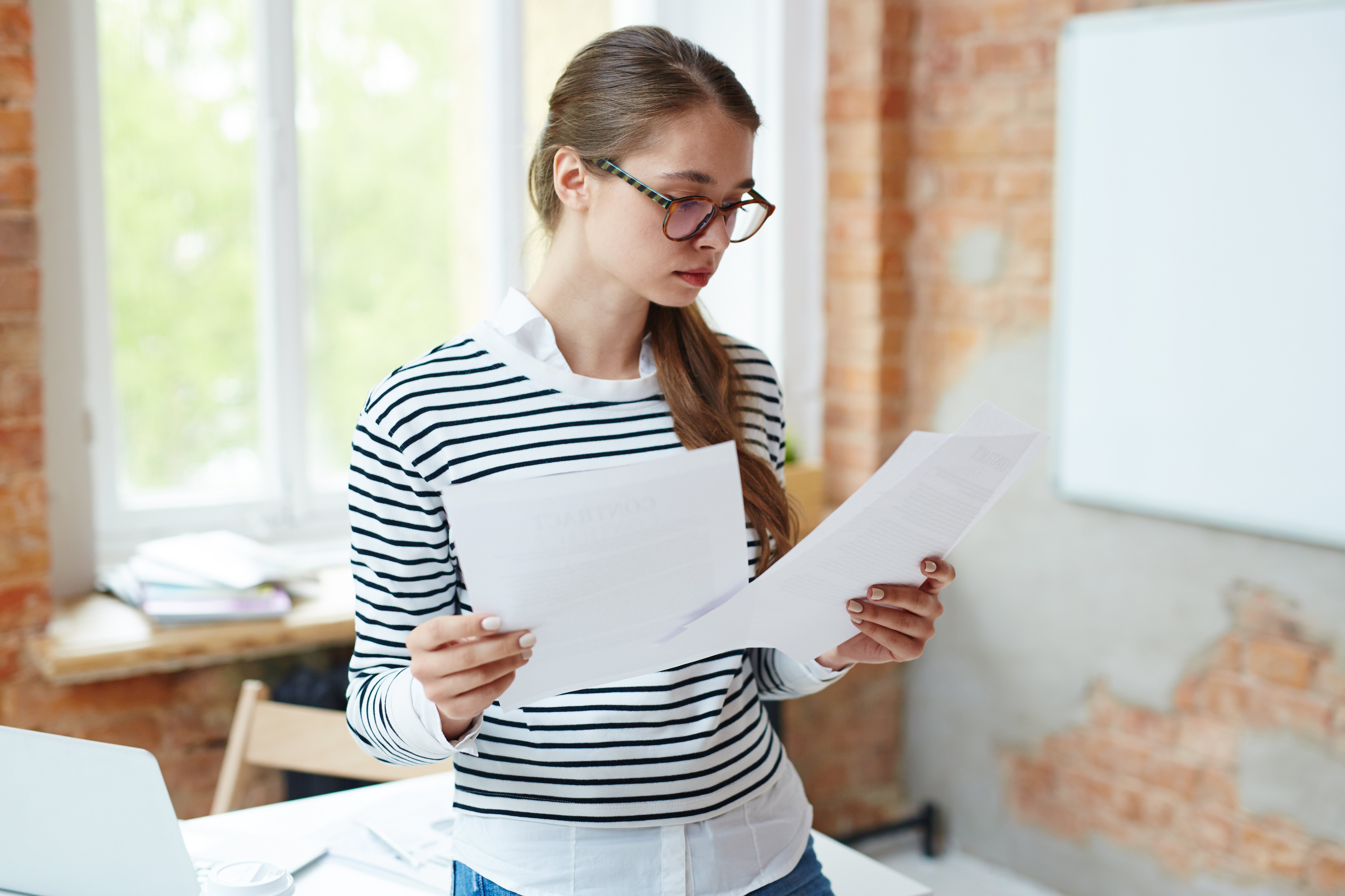 girl-reading-papers