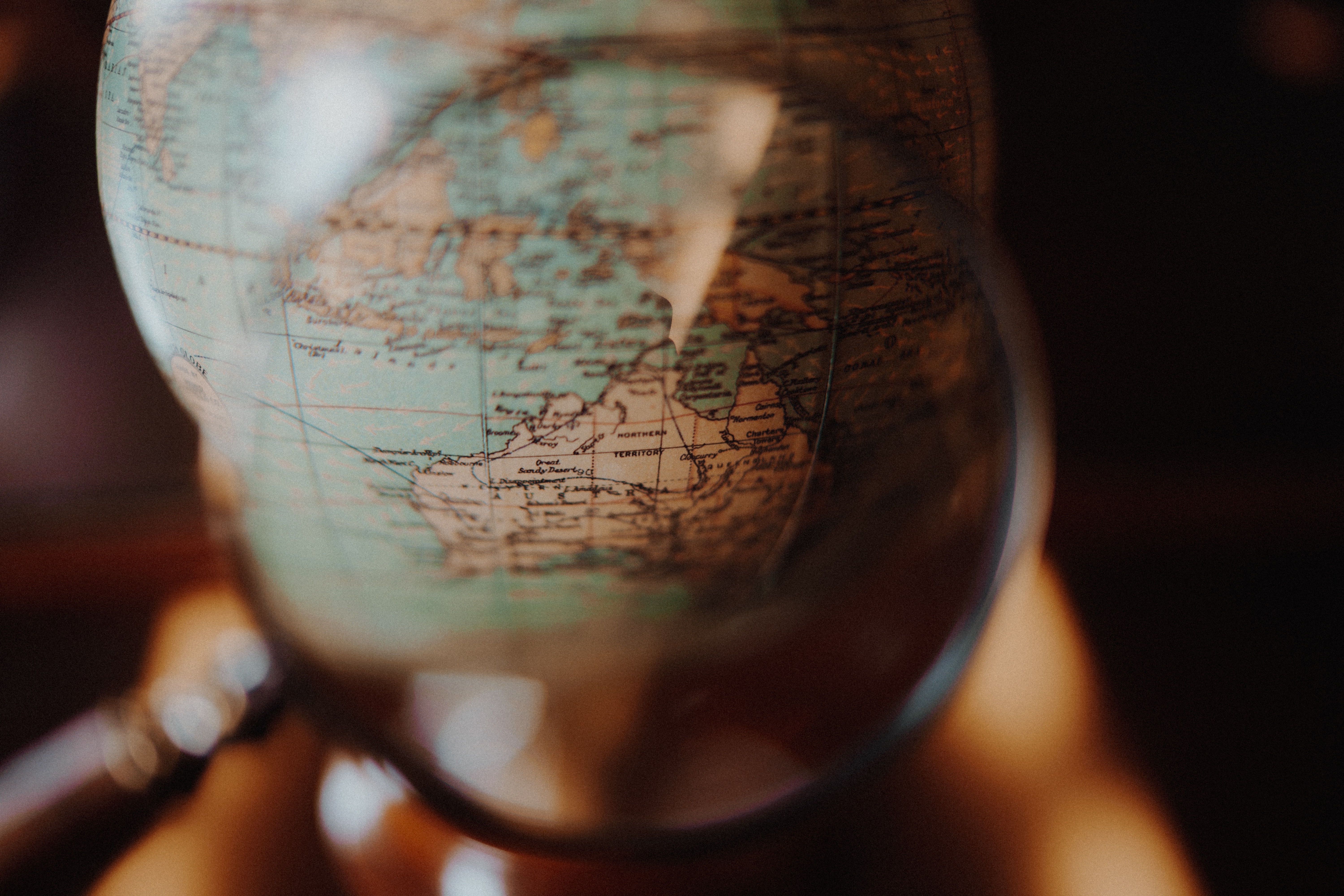 Magnifying glass on world map