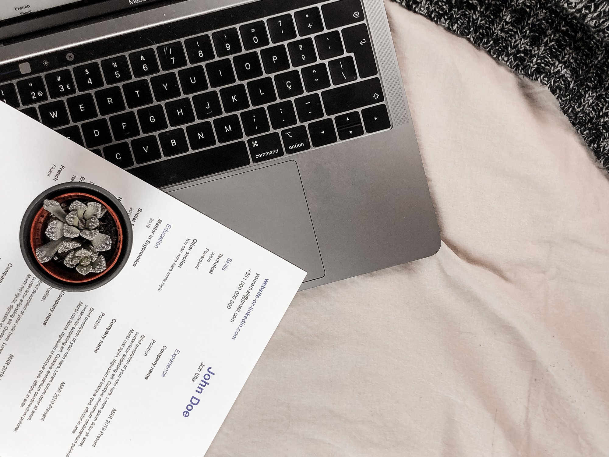 a laptop and a resume