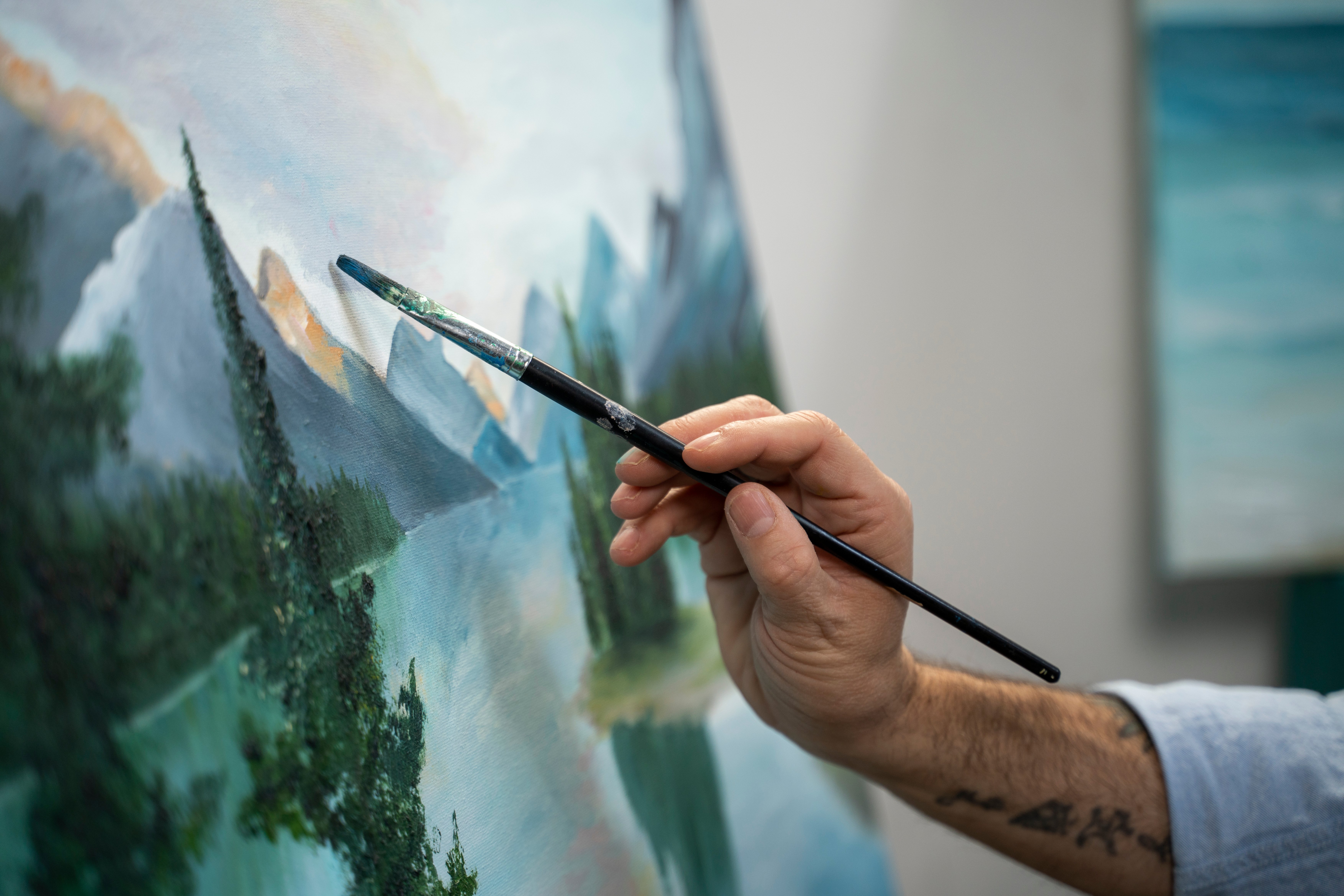 side-view-man-holding-painting-brush