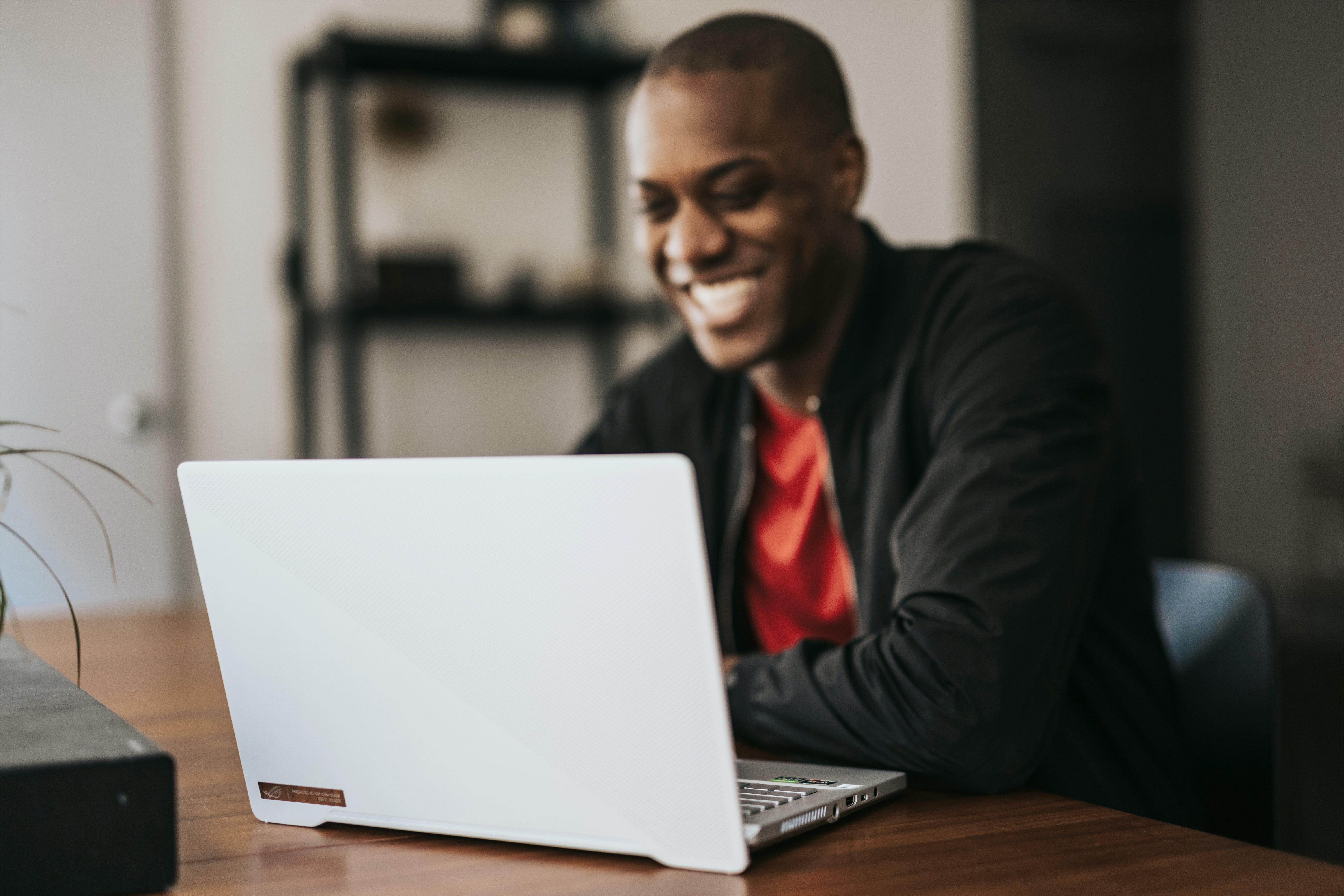 Smiling man working on his computer